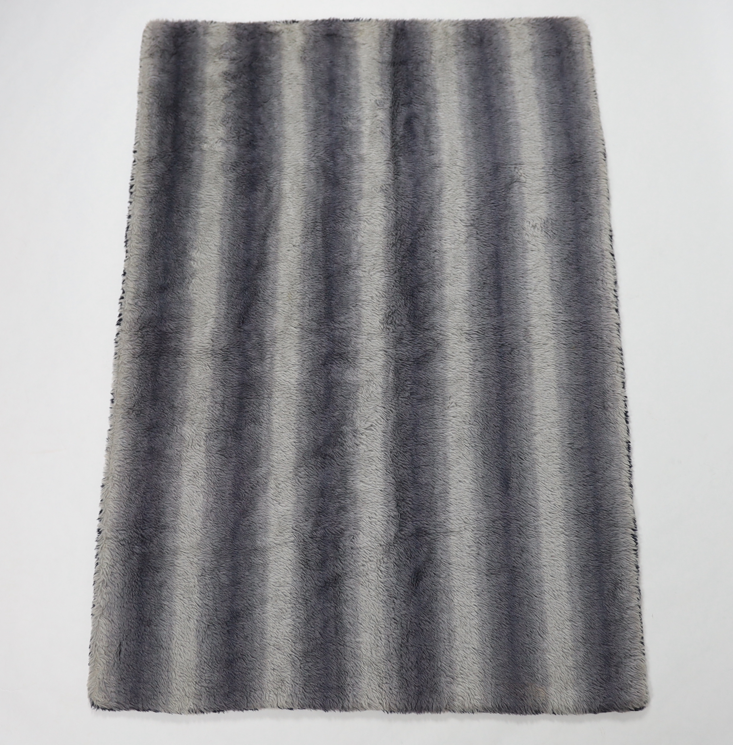 An unusual Motolux vintage car motoring rug, originally made in the 1930’s-40’s from Alpaca wool, reversible, one side navy and the other graduated grey, (the vendor remembers it keeping her warm in a Dicky seat as a chi